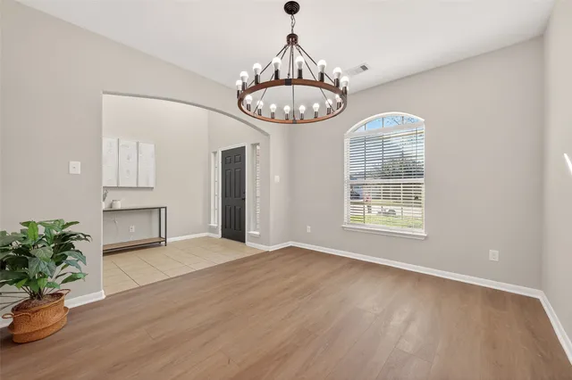 a kitchen with stainless steel appliances granite countertop a stove and a sink