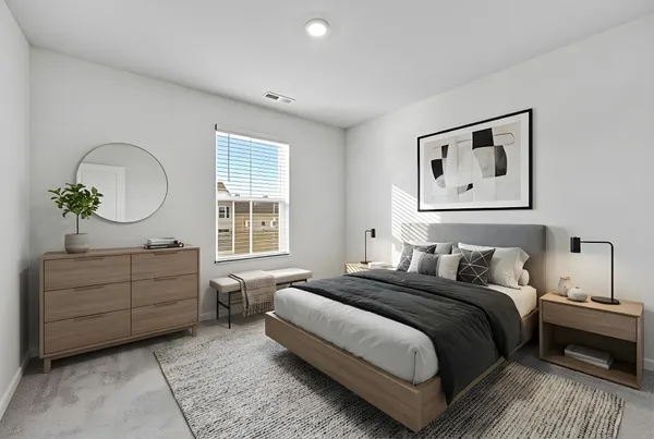 a bedroom with a bed and a dresser