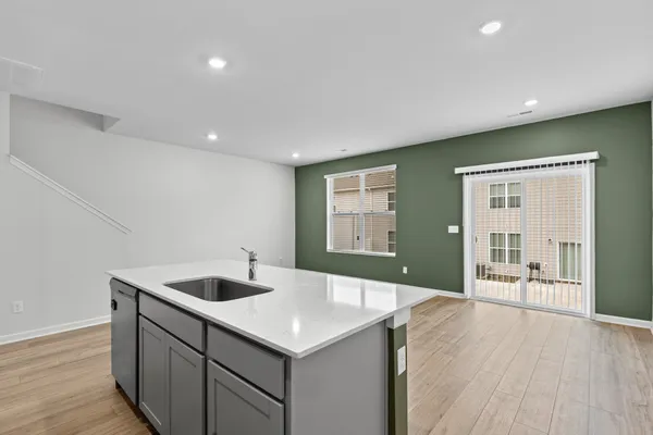 a kitchen with a sink and stove