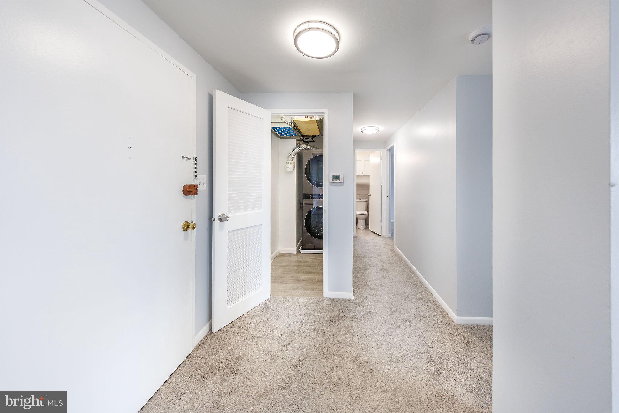 4600 Duke Street, Unit 622 Alexandria, VA 22304 - Photo 20 of 52 a view of a hallway with wooden shelves