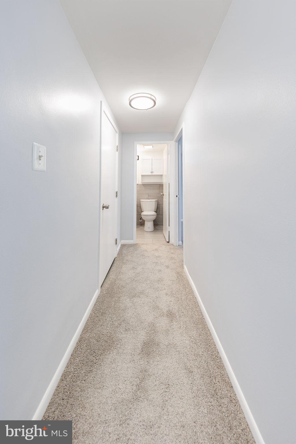 4600 Duke Street, Unit 622 Alexandria, VA 22304 - Photo 21 of 52 a view of a hallway with white walls