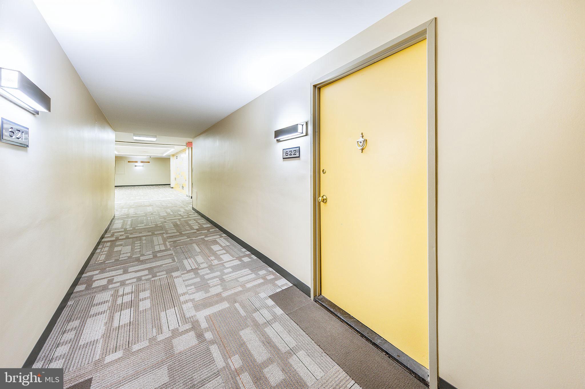 4600 Duke Street, Unit 622 Alexandria, VA 22304 - Photo 23 of 52 a view of hallway with a large window and refrigerator