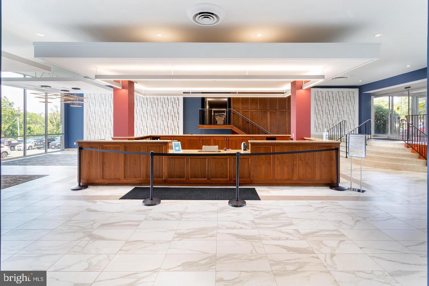 4600 Duke Street, Unit 622 Alexandria, VA 22304 - Photo 34 of 52 a living room with a couch and a flat screen tv