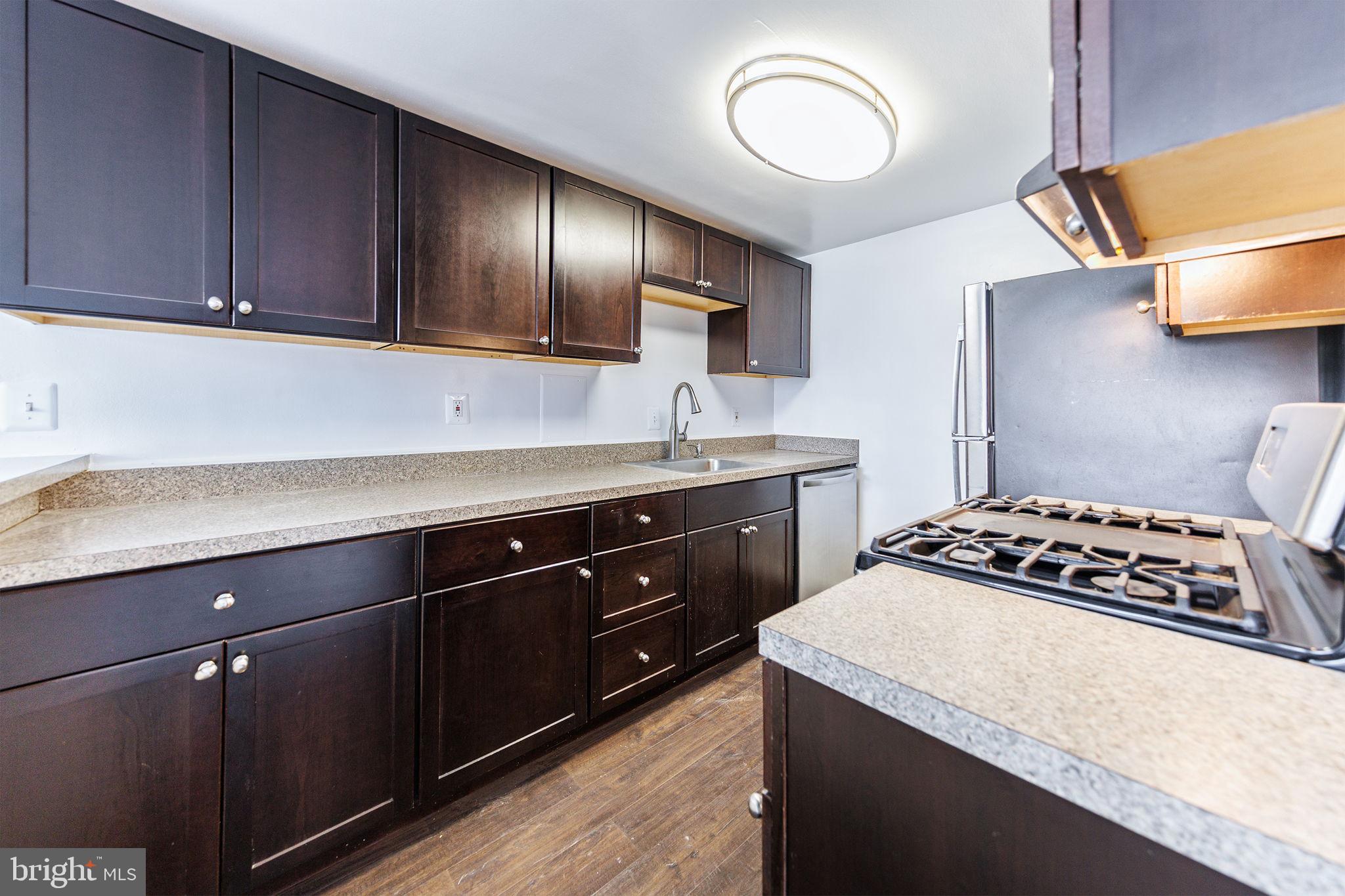 4600 Duke Street, Unit 622 Alexandria, VA 22304 - Photo 5 of 52 a kitchen with a cabinets and stove