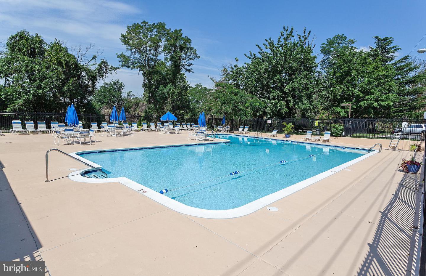 4600 Duke Street, Unit 622 Alexandria, VA 22304 - Photo 52 of 52 a view of a swimming pool with an outdoor seating