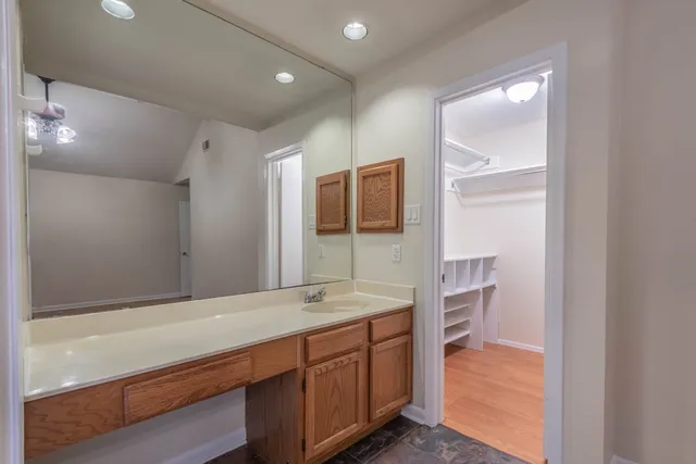 a bathroom with a sink double vanity and a tub