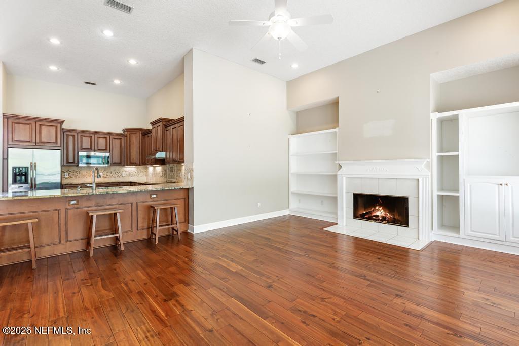 337 South Mill View Way Ponte Vedra Beach, FL 32082 - Photo 23 of 55 a view of a kitchen with workspace and fireplace