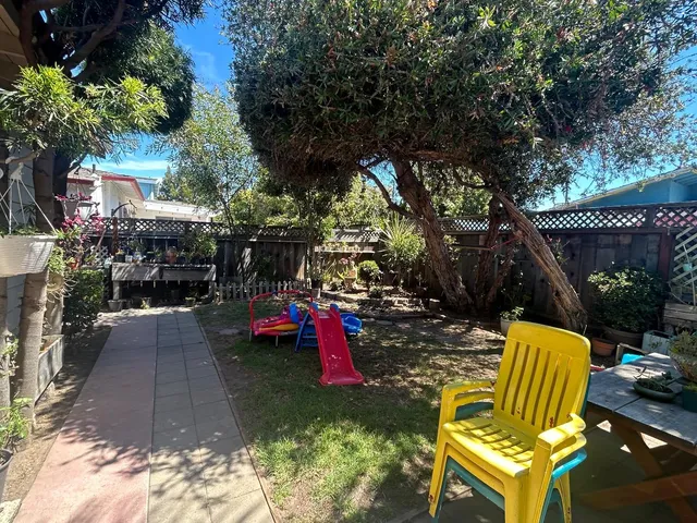 a view of a chairs and table in the patio