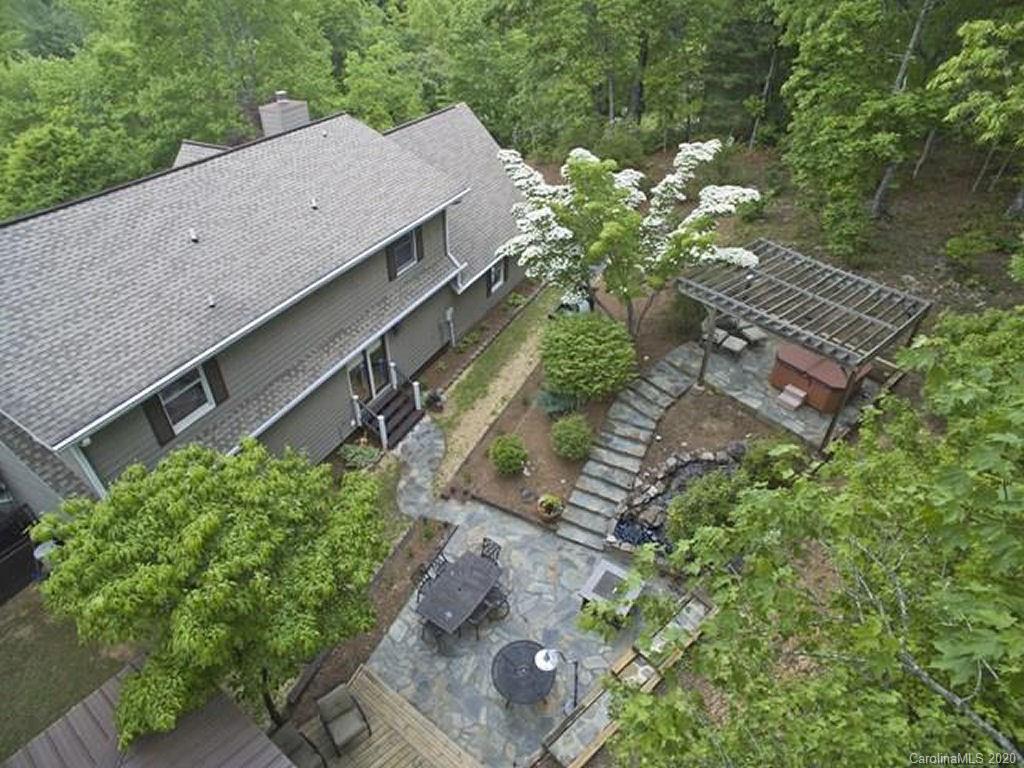 82 Gregg Roost Road Sylva, NC 28779 - Photo 1 of 35 a view of a garden with an outdoor seating