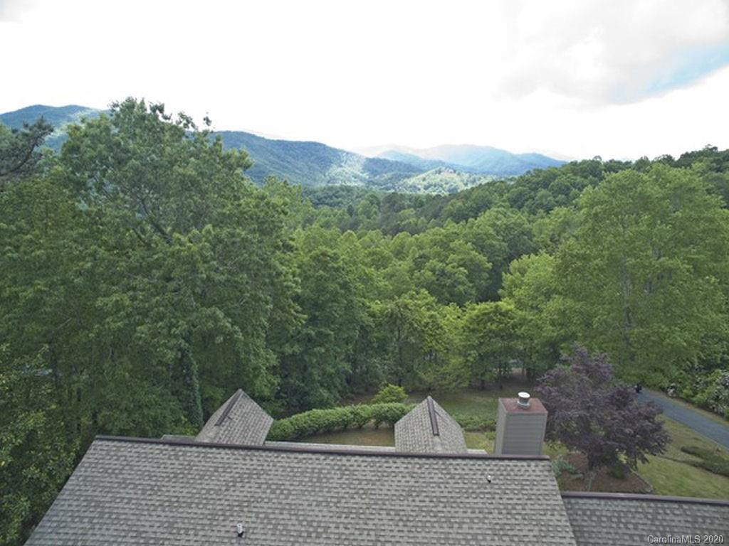 82 Gregg Roost Road Sylva, NC 28779 - Photo 11 of 35 a view of a green field with mountains in the background