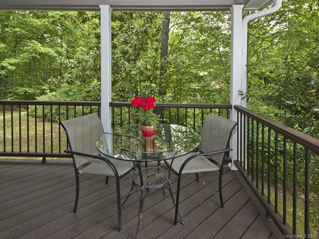 82 Gregg Roost Road Sylva, NC 28779 - Photo 13 of 35 a view of a chairs and table in patio with wooden floor