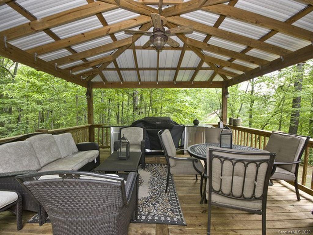 82 Gregg Roost Road Sylva, NC 28779 - Photo 14 of 35 a view of a patio on the deck