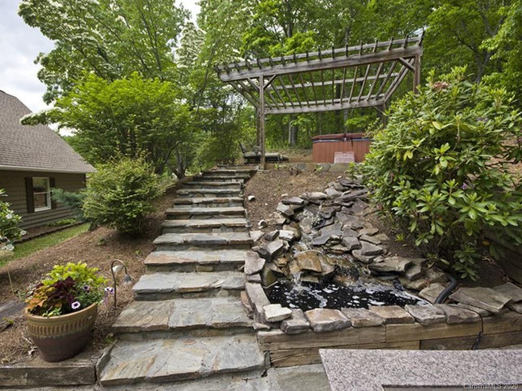 82 Gregg Roost Road Sylva, NC 28779 - Photo 15 of 35 a view of a patio with a chairs and potted plants