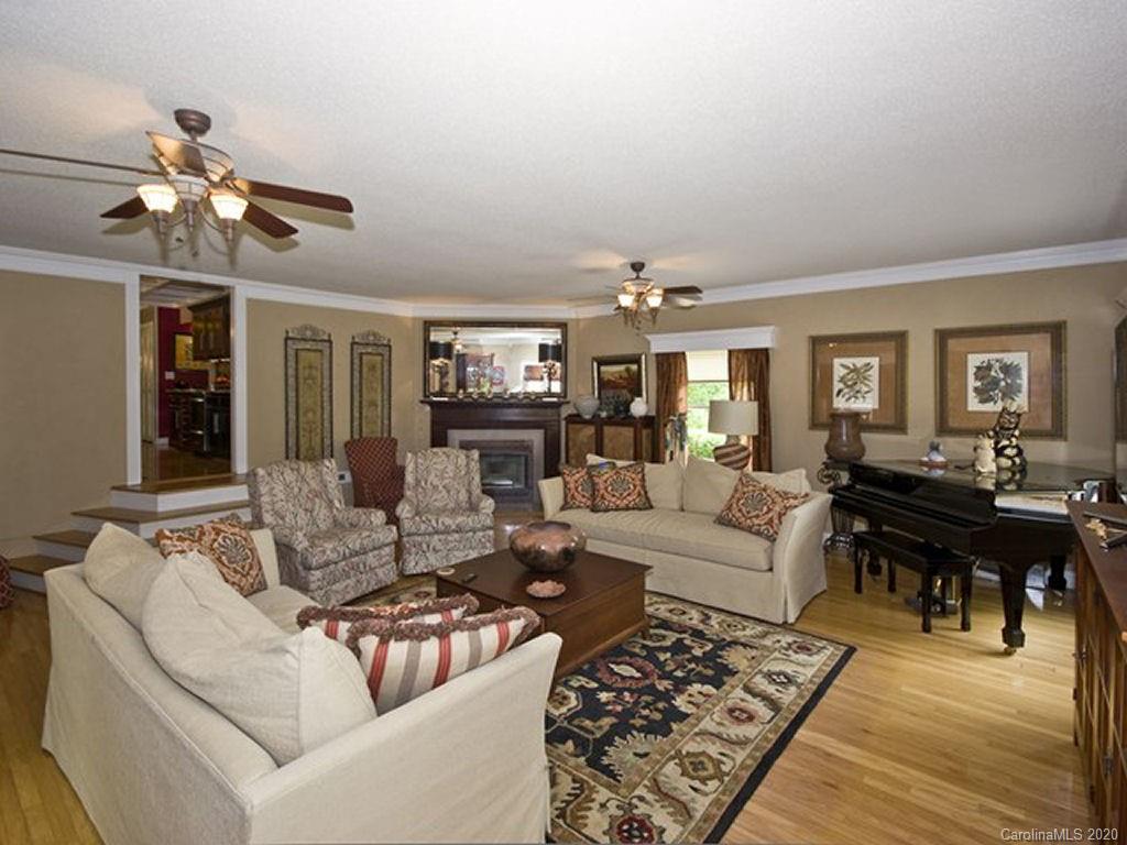 82 Gregg Roost Road Sylva, NC 28779 - Photo 16 of 35 a living room with furniture and a wooden floor