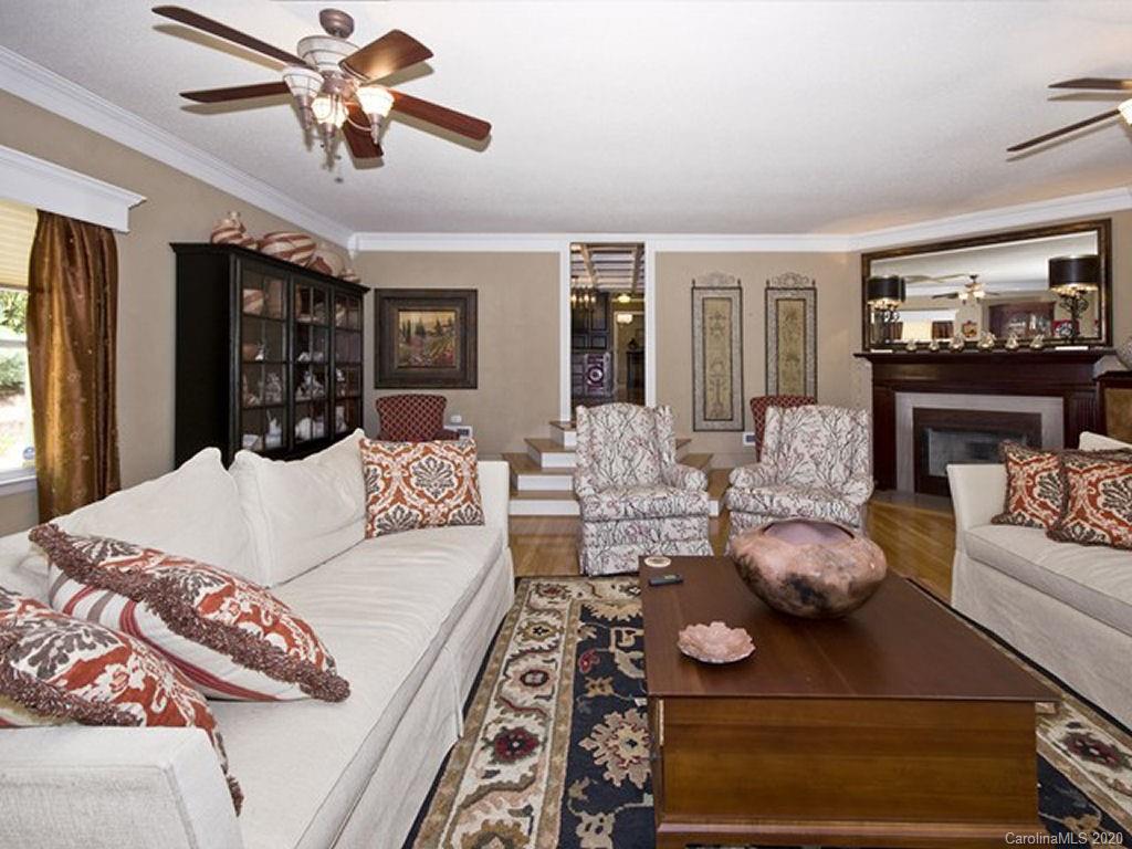 82 Gregg Roost Road Sylva, NC 28779 - Photo 17 of 35 a living room with furniture fireplace and flat screen tv