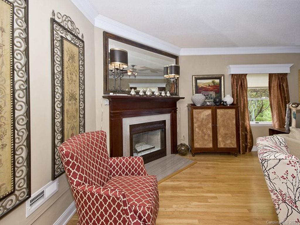 82 Gregg Roost Road Sylva, NC 28779 - Photo 19 of 35 a living room with furniture and a fireplace