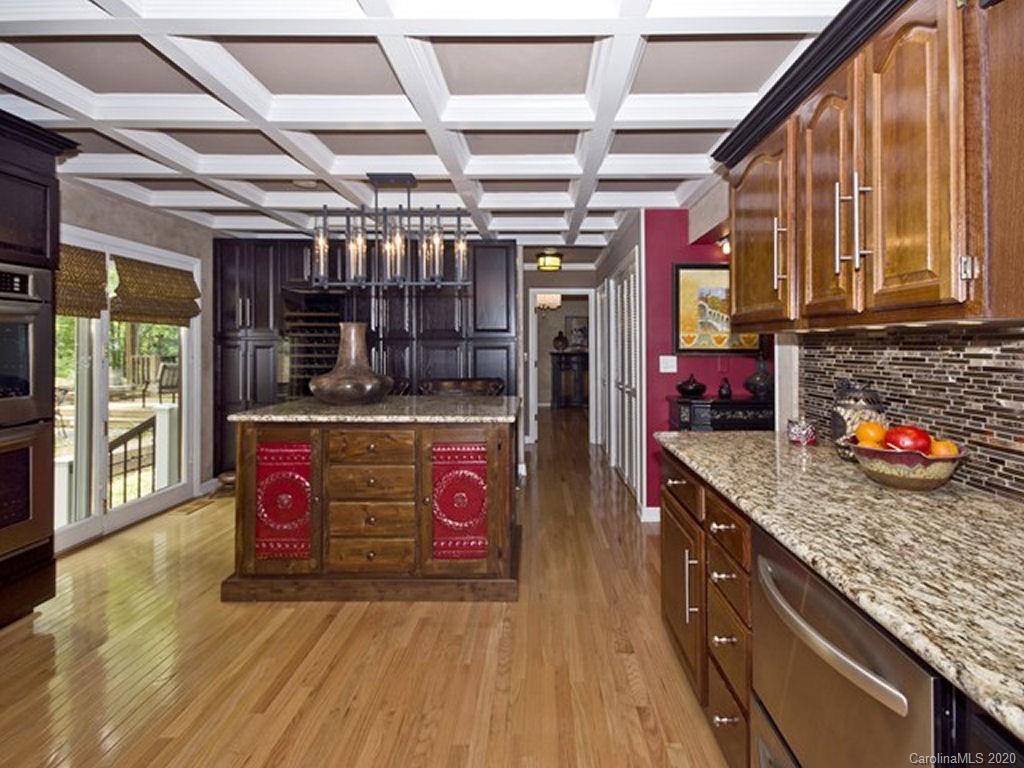 82 Gregg Roost Road Sylva, NC 28779 - Photo 20 of 35 a kitchen with stainless steel appliances granite countertop a stove a sink and a microwave
