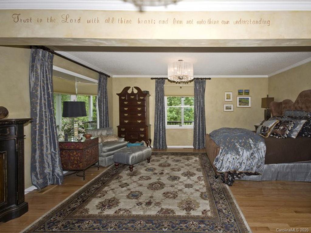 82 Gregg Roost Road Sylva, NC 28779 - Photo 23 of 35 a living room with furniture and a fireplace