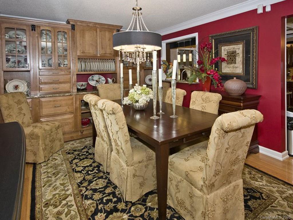 82 Gregg Roost Road Sylva, NC 28779 - Photo 27 of 35 a view of a dining room with furniture and chandelier