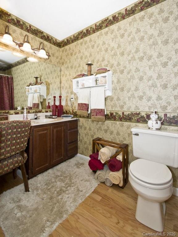82 Gregg Roost Road Sylva, NC 28779 - Photo 29 of 35 a bathroom with a toilet sink and mirror