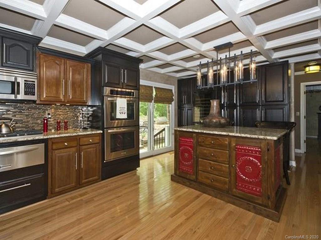 82 Gregg Roost Road Sylva, NC 28779 - Photo 35 of 35 a kitchen with stainless steel appliances granite countertop a stove and cabinets