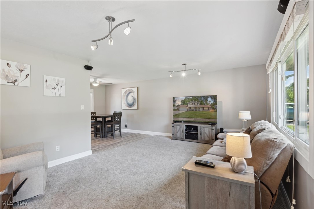 Bright and inviting living room with a stunning picture window that fills the space with natural light—perfect for relaxing or entertaining