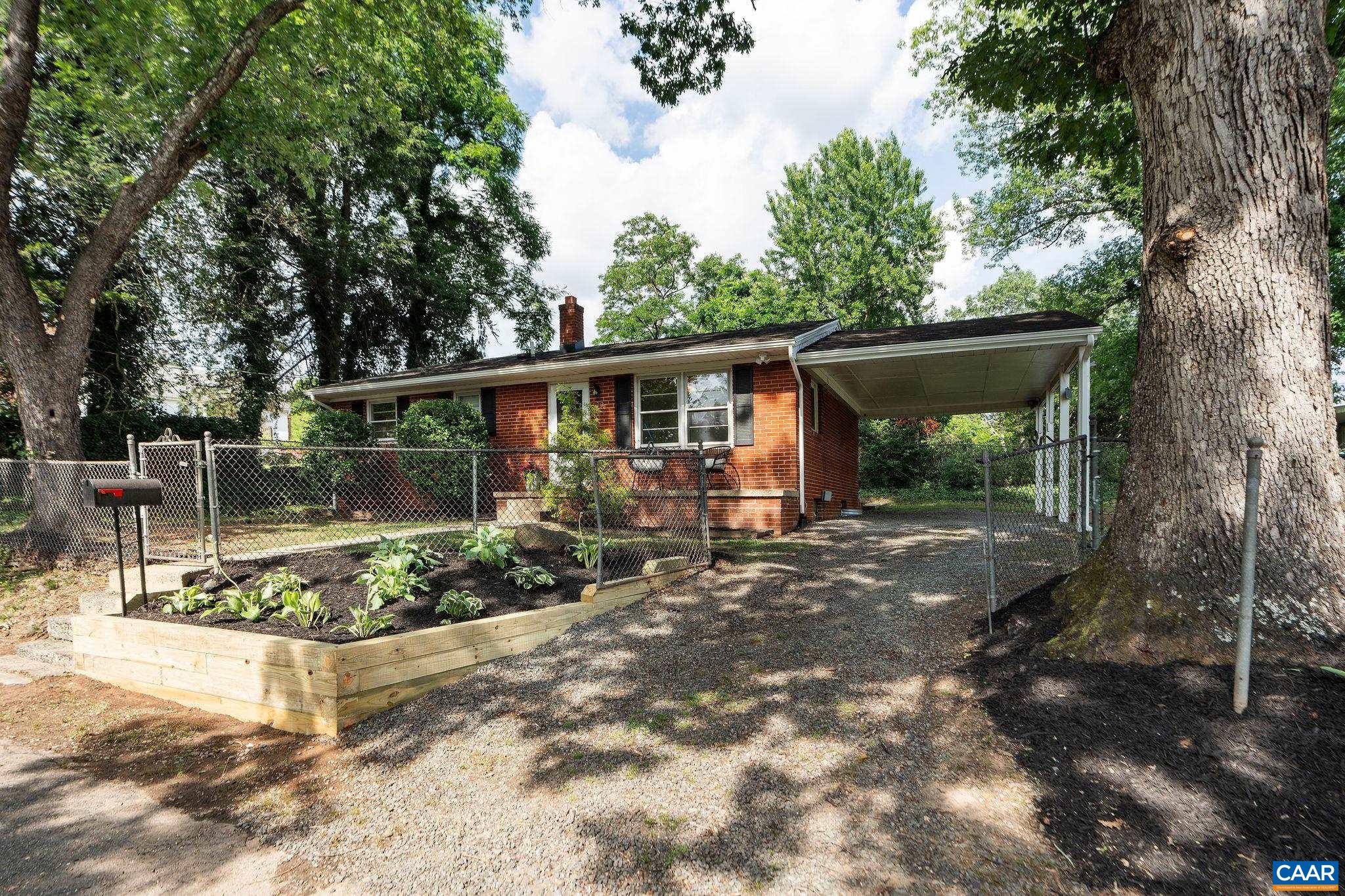 122 Westerly Avenue, Unit WHOLE HOUSE Charlottesville, VA 22903 - Photo 15 of 16 a view of a house with backyard and sitting area