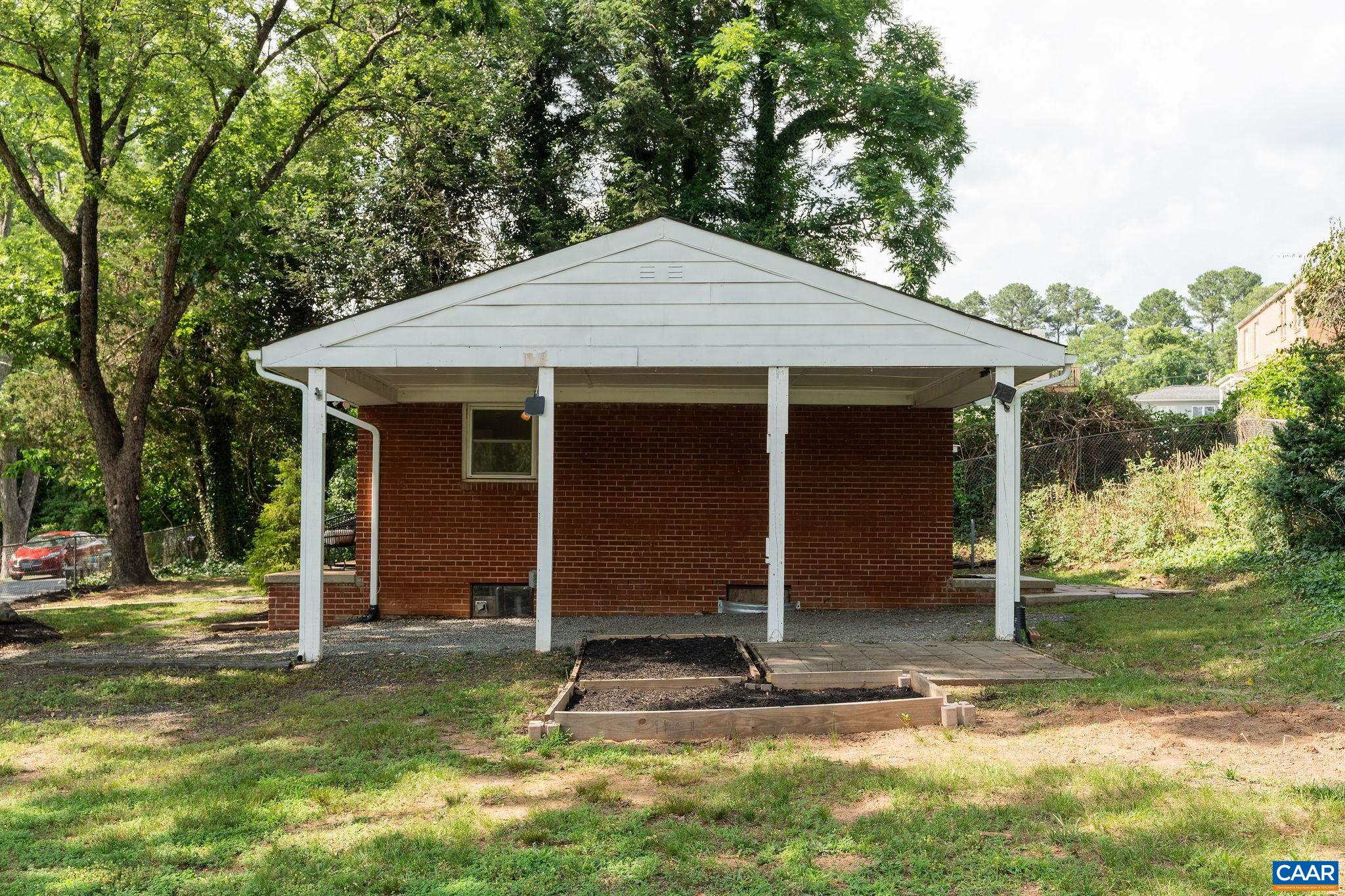 122 Westerly Avenue, Unit WHOLE HOUSE Charlottesville, VA 22903 - Photo 16 of 16 a front view of a house with a yard