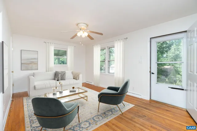 a living room with furniture and a window