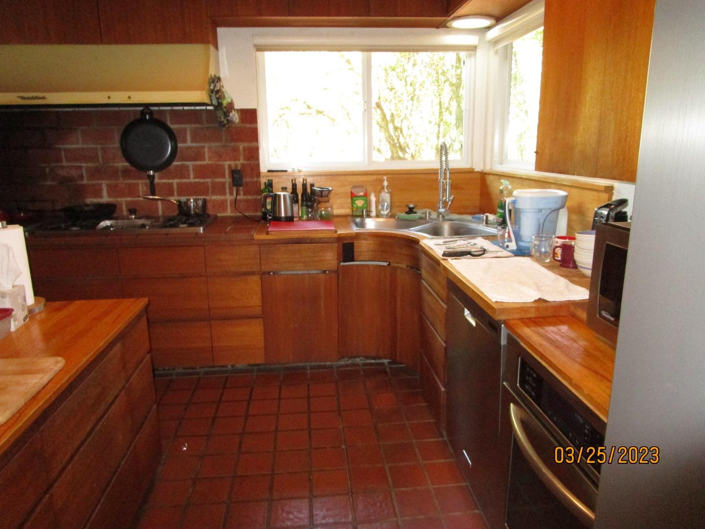 225 View Court Aptos, CA 95003 - Photo 13 of 39 a kitchen with a sink and a stove next to a window