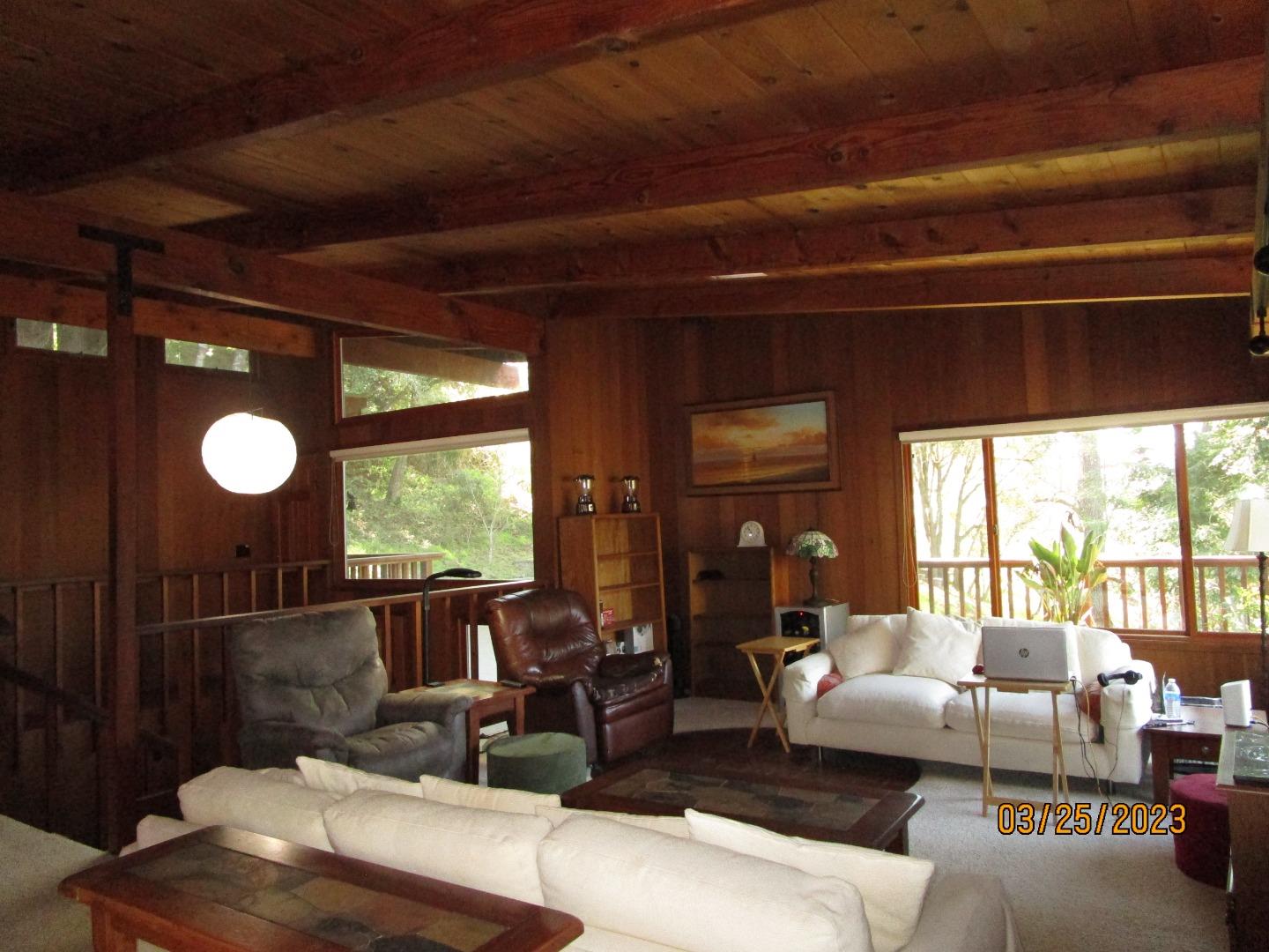 225 View Court Aptos, CA 95003 - Photo 14 of 39 a living room with furniture and a large window