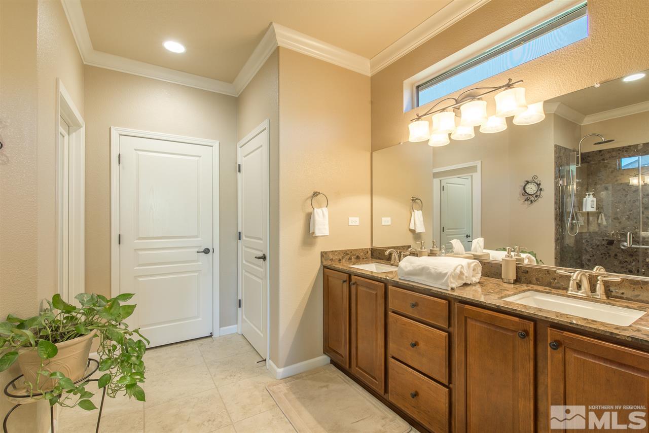 1180 Callaway Trail Reno, NV 89523 - Photo 11 of 19 a bathroom with a double vanity sink and a mirror