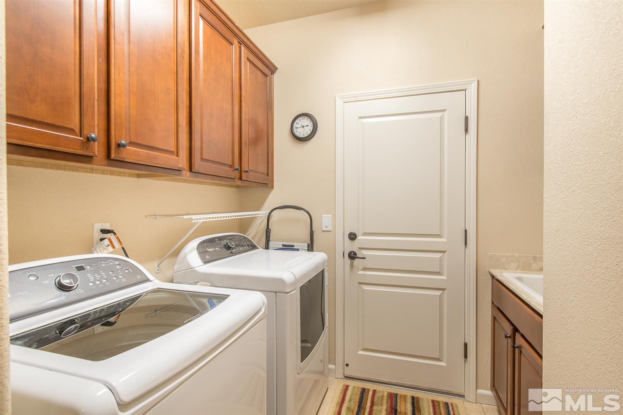1180 Callaway Trail Reno, NV 89523 - Photo 15 of 19 a bathroom with a sink and a washer dryer