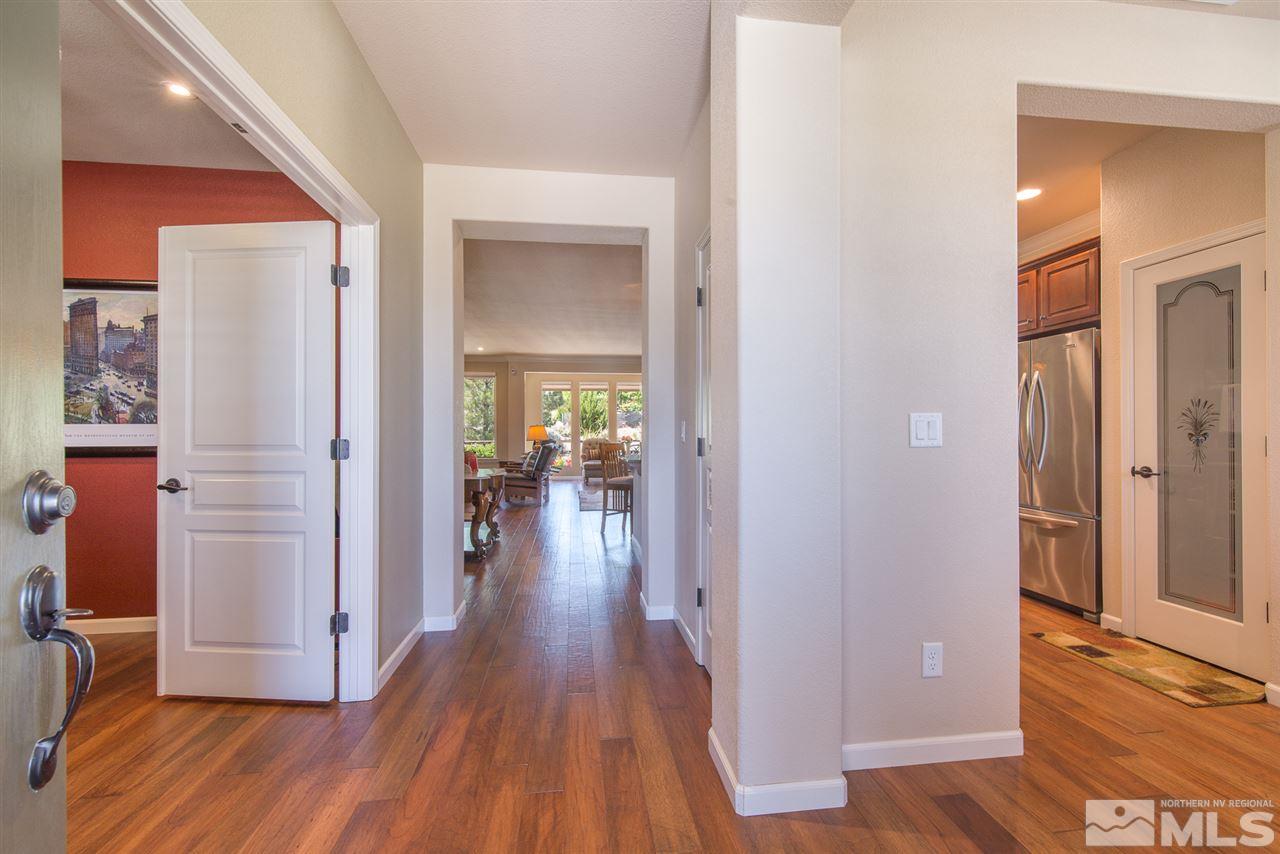 1180 Callaway Trail Reno, NV 89523 - Photo 3 of 19 a view of a hallway with wooden floor