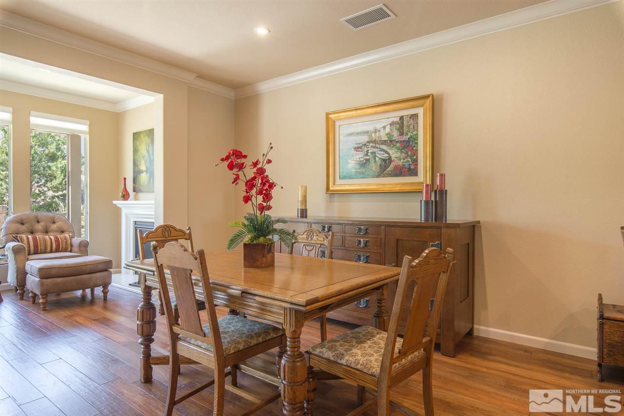 1180 Callaway Trail Reno, NV 89523 - Photo 7 of 19 a view of a dining room with furniture and wooden floor