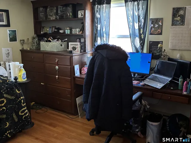 a workspace with furniture and window