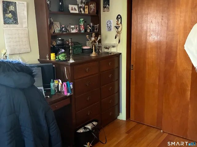 a view of living room with wooden floor