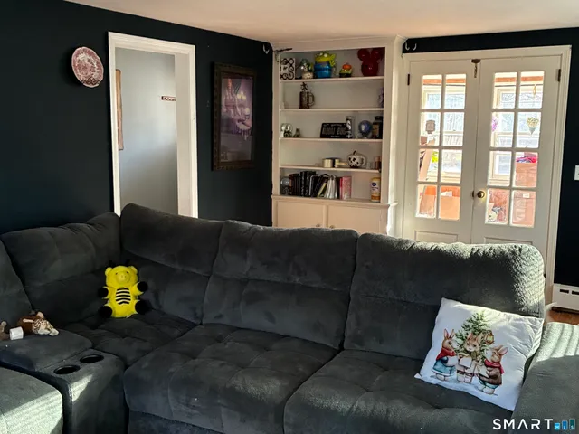 a living room with furniture and a window