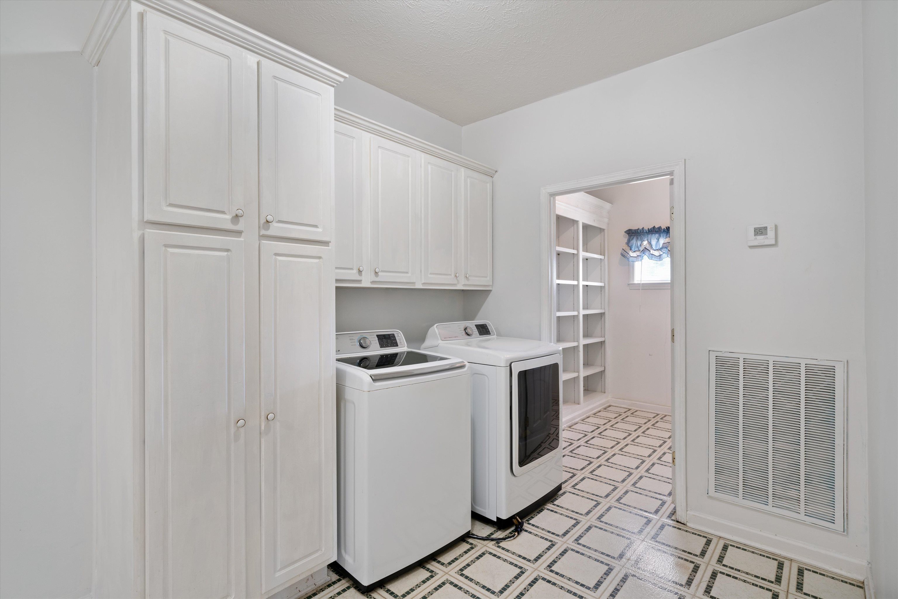 130 Belmont Road Mason, TN 38049 - Photo 12 of 24 Laundry area featuring cabinets and washer and dryer