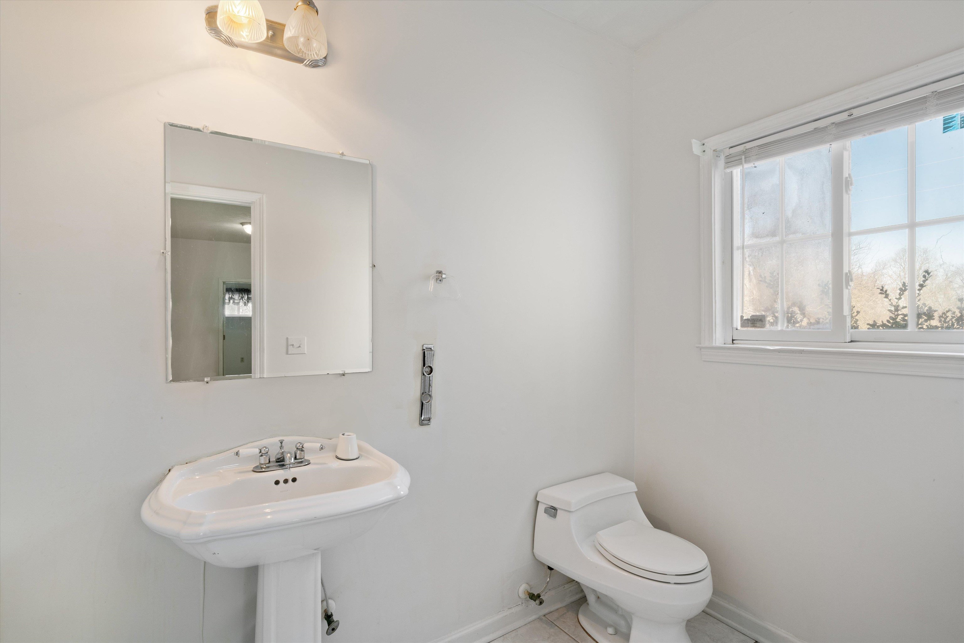130 Belmont Road Mason, TN 38049 - Photo 14 of 24 Bathroom featuring sink, tile patterned floors, and toilet