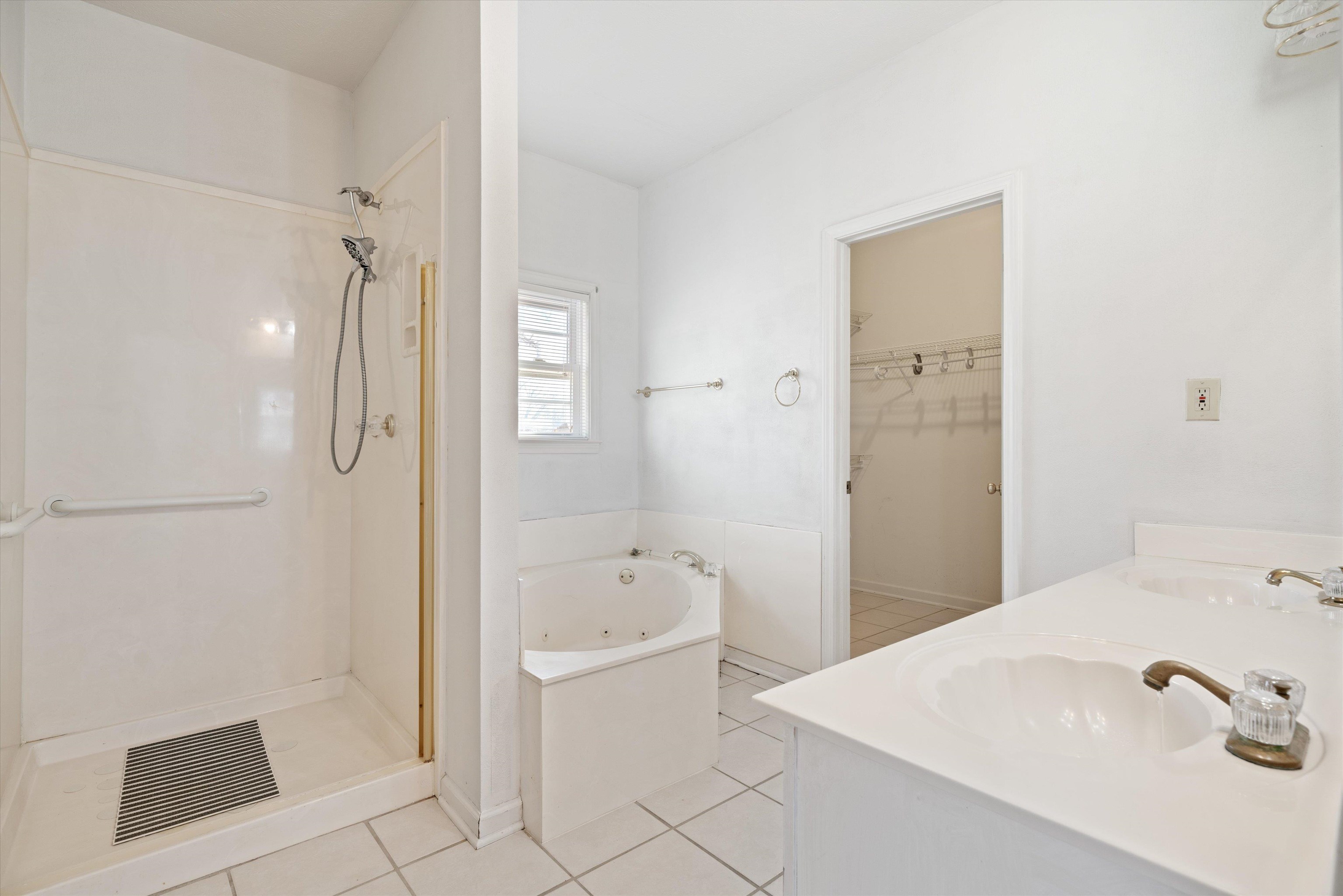 130 Belmont Road Mason, TN 38049 - Photo 16 of 24 Bathroom featuring tile patterned flooring, vanity, and separate shower and tub