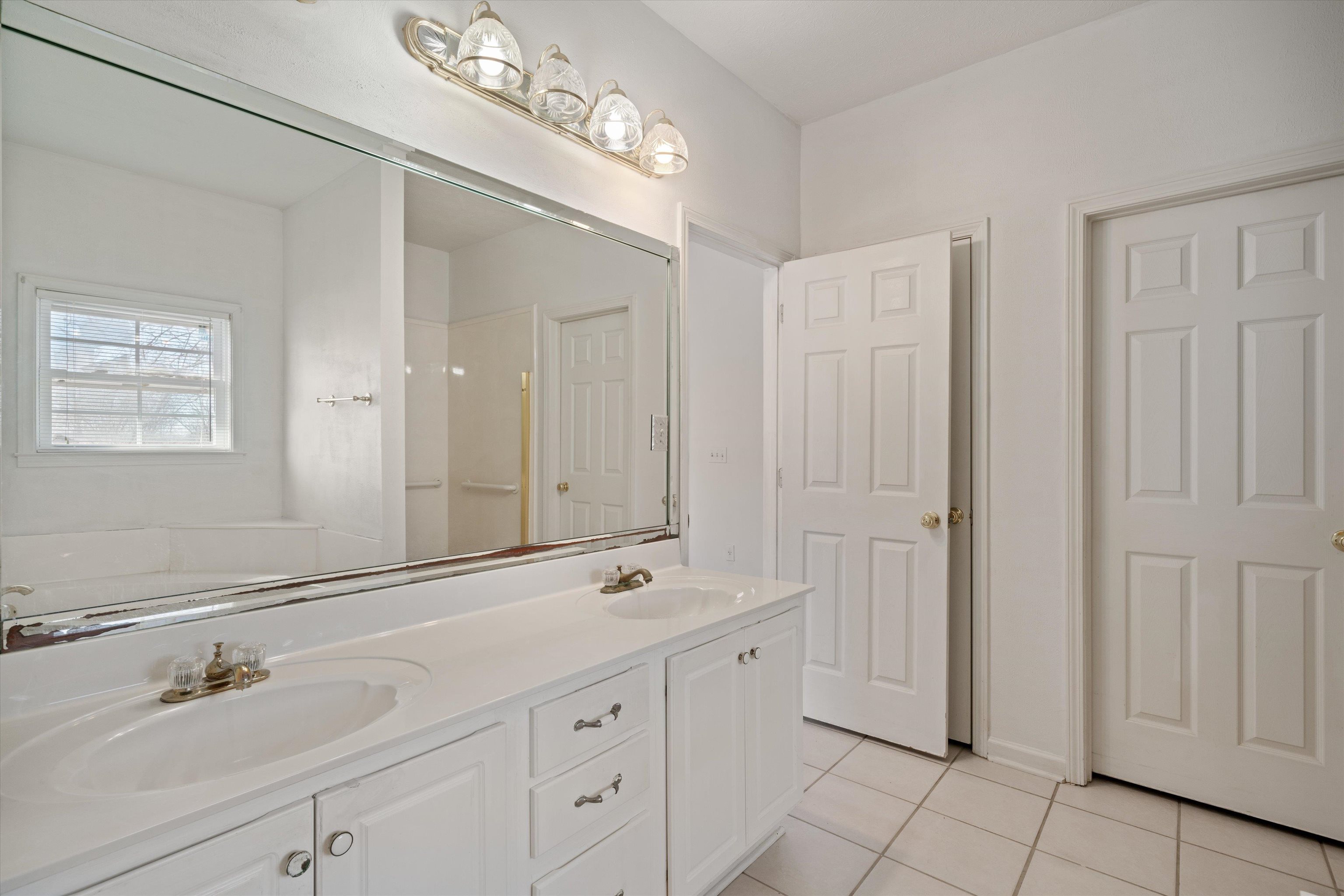 130 Belmont Road Mason, TN 38049 - Photo 17 of 24 Bathroom featuring vanity and tile patterned flooring
