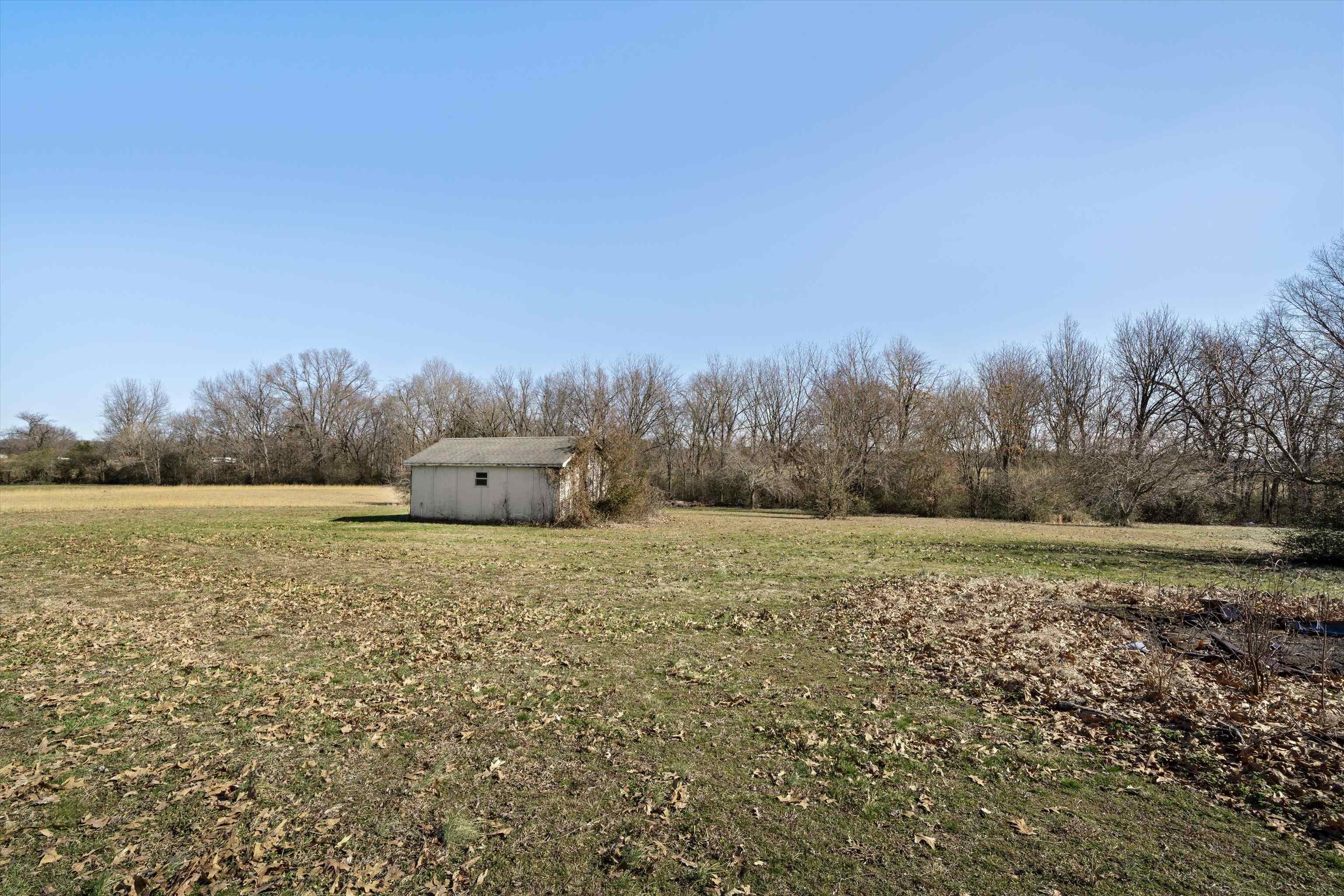 130 Belmont Road Mason, TN 38049 - Photo 23 of 24 View of yard featuring an outdoor structure and a rural view