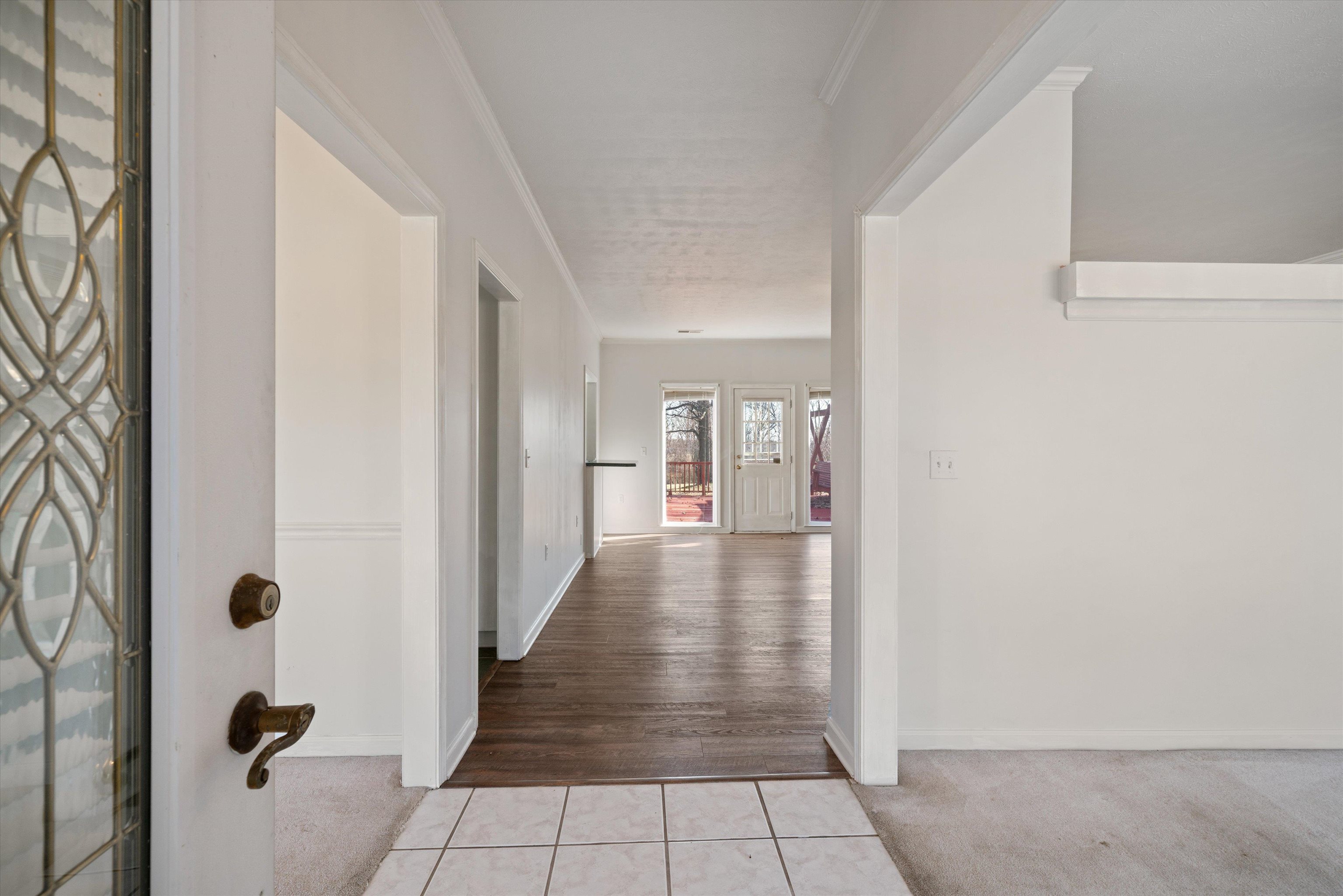 130 Belmont Road Mason, TN 38049 - Photo 3 of 24 Hall with ornamental molding and light tile patterned flooring