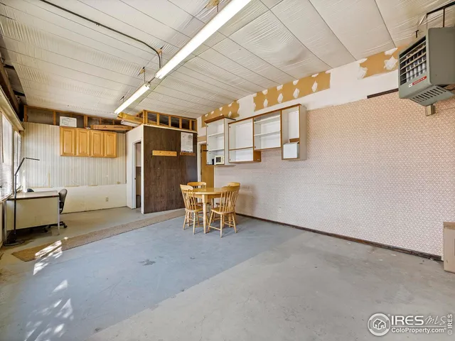 a view of a room with furniture and a window