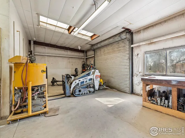 a view of a garage with red car