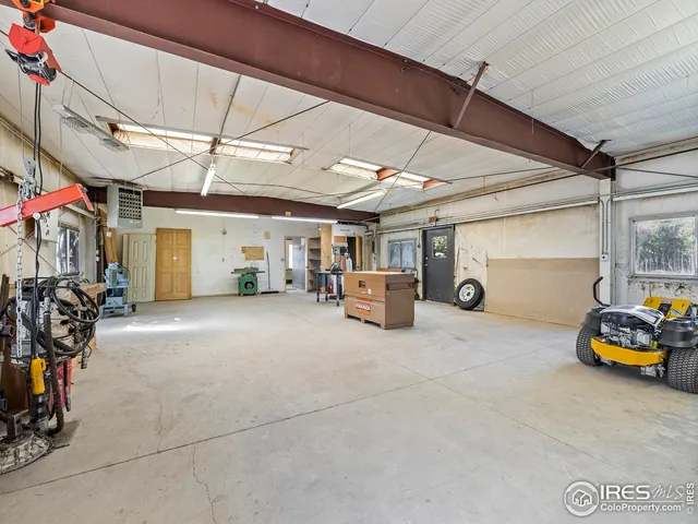 a view of parking garage with cars