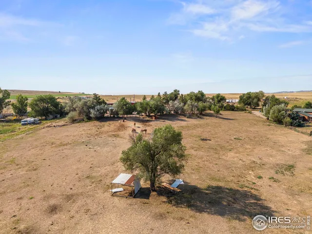 a view of a lake with a yard