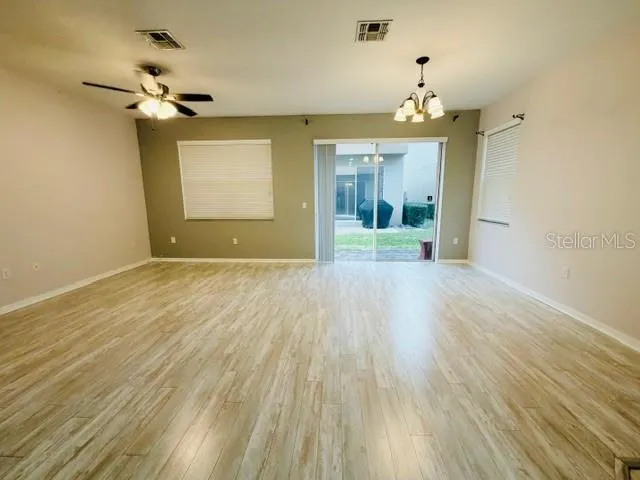 a view of a chandelier with a wooden floor