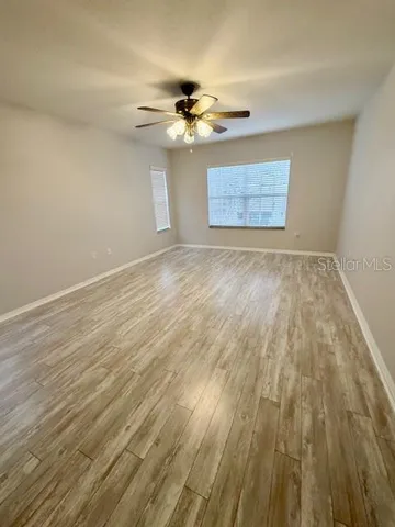 a view of room with wooden floor